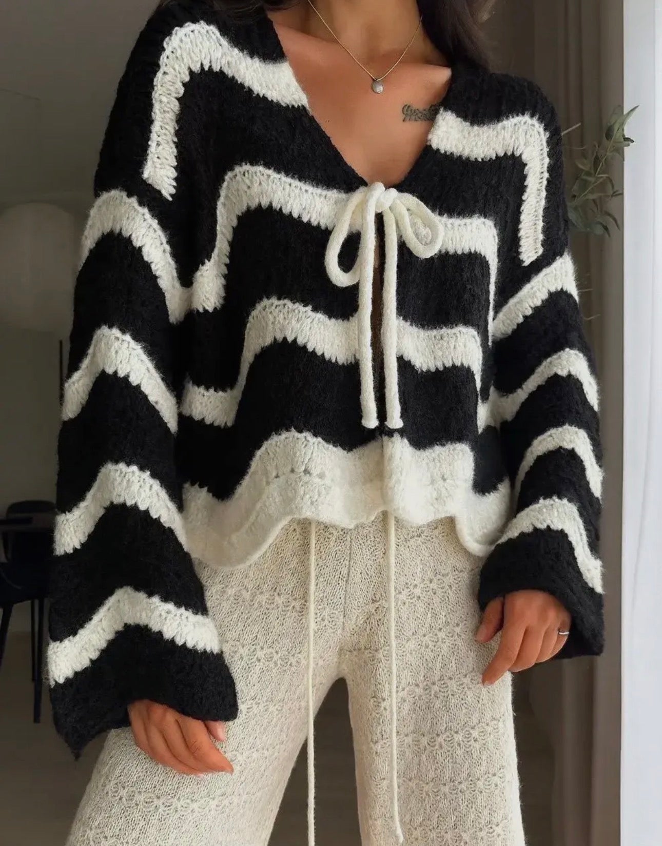 Wave Cardigan mit Schürdetail